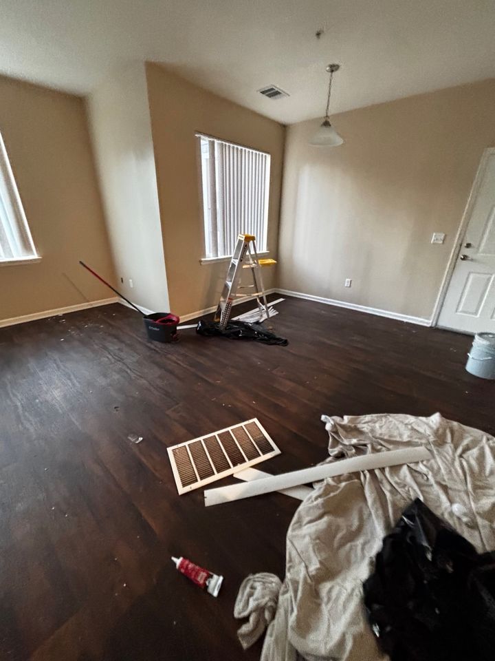 Dining area before cleaning, with tools and trash on the floor